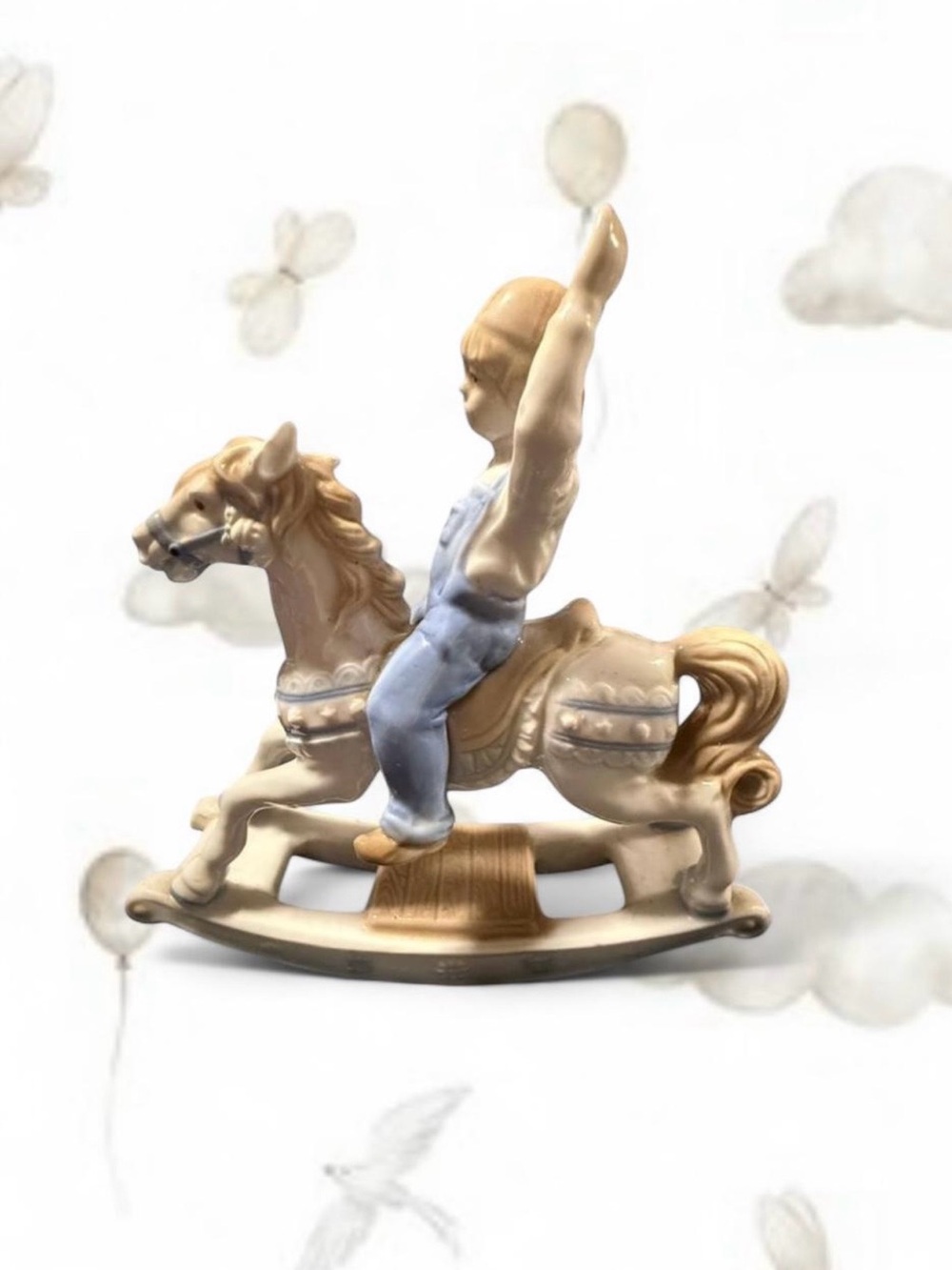 Paul Sebastian porcelain figurine of a boy on a rocking horse, dated 1991